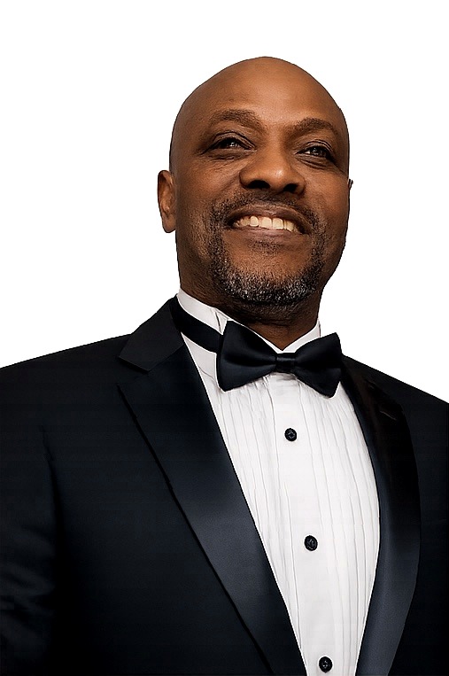 John Saint Vil in a formal tuxedo portrait